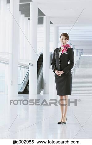 Stock Photography - Japanese attractive flight attendant at the airport. Fotosearch