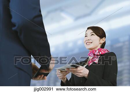 Japanese attractive flight attendant helping customer at the airport View Large Photo Image Stock Image - Japanese attractive flight attendant helping customer at the airport. Fotosearch