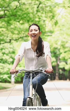 Japanese attractive woman in a city park View Large Photo Image Picture - Japanese attractive woman in a city park. Fotosearch