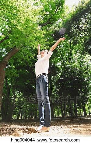 Picture - Japanese attractive woman in a city park. Fotosearch