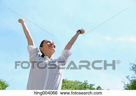 Stock Photograph - Japanese attractive woman in a city park. Fotosearch