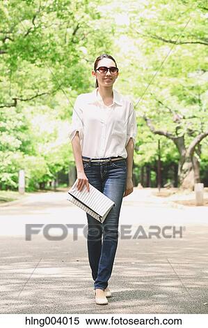 Stock Photography - Japanese attractive woman in a city park. Fotosearch