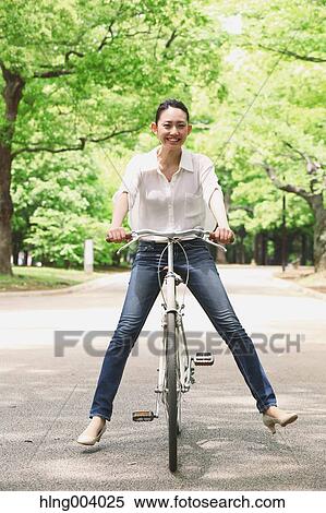 Stock Photography - Japanese attractive woman in a city park. Fotosearch