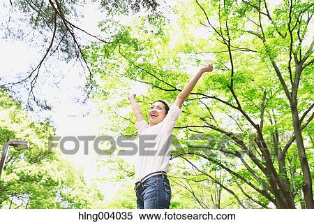 Japanese attractive woman in a city park View Large Photo Image Stock Photography - Japanese attractive woman in a city park. Fotosearch