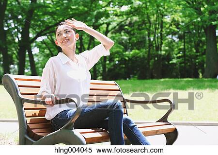 Japanese attractive woman in a city park View Large Photo Image Stock Photography - Japanese attractive woman in a city park. Fotosearch
