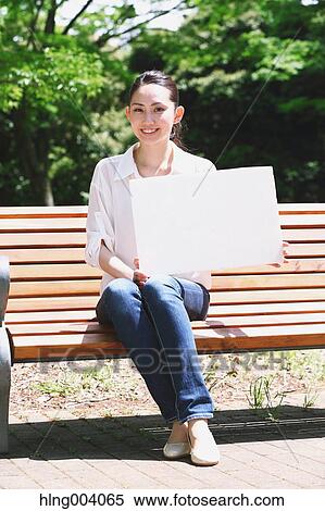 Japanese attractive woman in a city park View Large Photo Image Stock Photography - Japanese attractive woman in a city park. Fotosearch