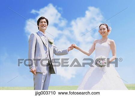 Japanese bride and groom in a city park View Large Photo Image Stock Image - Japanese bride and groom in a city park. Fotosearch