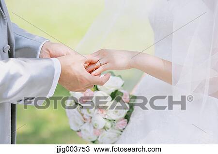 Japanese bride and groom in a city park View Large Photo Image Stock Image - Japanese bride and groom in a city park. Fotosearch