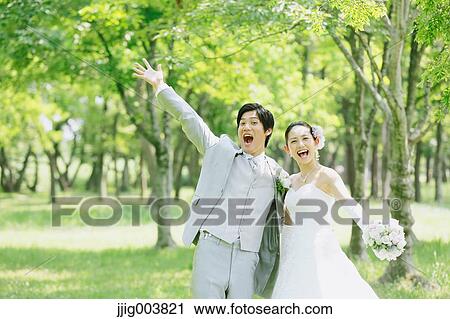 Japanese bride and groom in a city park View Large Photo Image Stock Image - Japanese bride and groom in a city park. Fotosearch