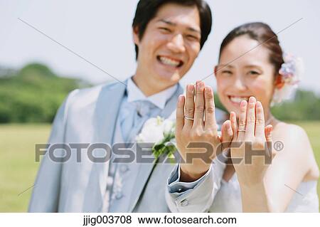 Japanese bride and groom in a city park View Large Photo Image Stock Photo - Japanese bride and groom in a city park. Fotosearch