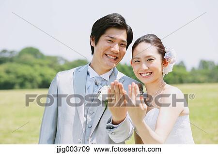 Japanese bride and groom in a city park View Large Photo Image Stock Photo - Japanese bride and groom in a city park. Fotosearch