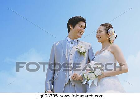 Japanese bride and groom in a city park View Large Photo Image Stock Photography - Japanese bride and groom in a city park. Fotosearch