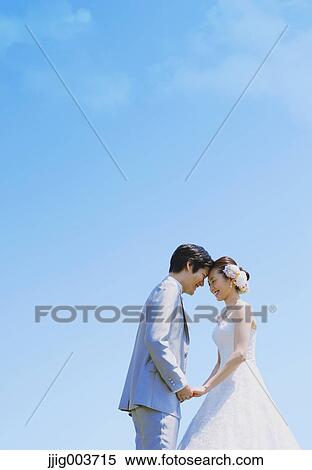 Japanese bride and groom in a city park View Large Photo Image Stock Photography - Japanese bride and groom in a city park. Fotosearch