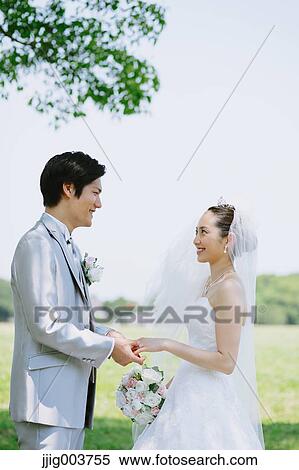Japanese bride and groom in a city park View Large Photo Image Stock Photography - Japanese bride and groom in a city park. Fotosearch