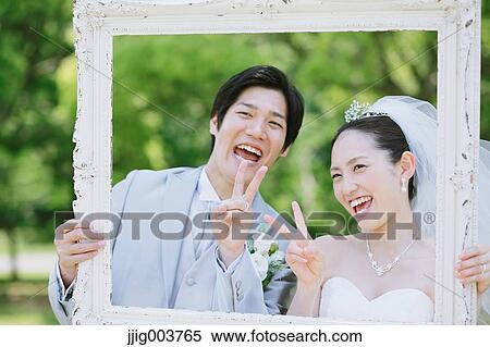 Japanese bride and groom in a city park View Large Photo Image Stock Photography - Japanese bride and groom in a city park. Fotosearch