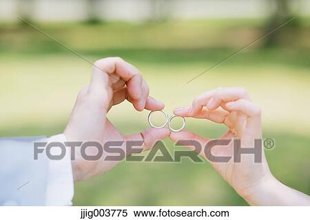 Stock Photography - Japanese bride and groom in a city park. Fotosearch