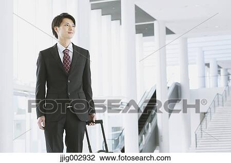 Japanese businessman at the airport View Large Photo Image Stock Image - Japanese businessman at the airport. Fotosearch