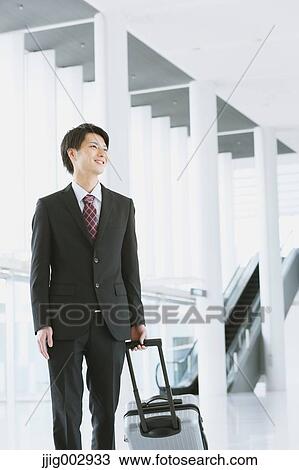 Japanese businessman at the airport View Large Photo Image Stock Image - Japanese businessman at the airport. Fotosearch