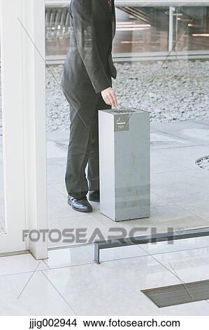 Picture - Japanese businessman smoking. Fotosearch