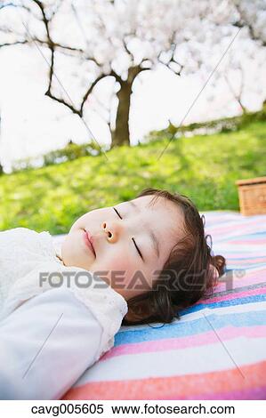 Japanese girl resting under the cherry blossoms View Large Photo Image Stock Photography - Japanese girl resting under the cherry blossoms. Fotosearch