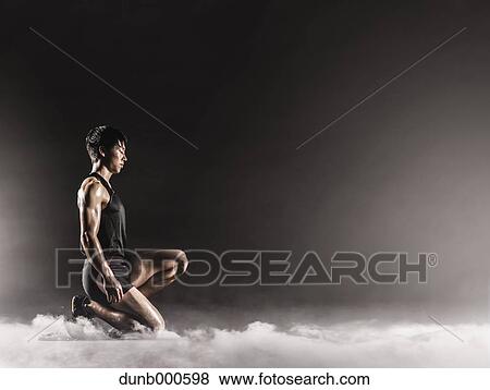 Japanese male athlete preparing to run View Large Photo Image Stock Photo - Japanese male athlete preparing to run. Fotosearch