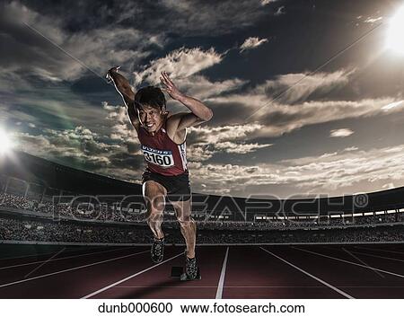Stock Image - Japanese male athlete running. Fotosearch