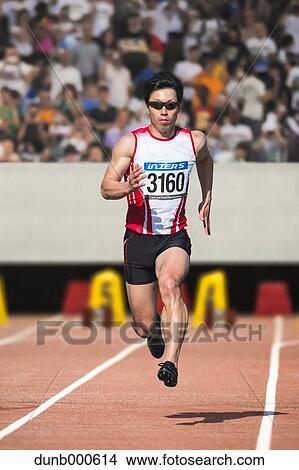 Japanese male sprinter running on track View Large Photo Image Picture - Japanese male sprinter running on track. Fotosearch