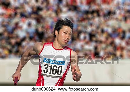 Japanese male sprinter running on track View Large Photo Image Picture - Japanese male sprinter running on track. Fotosearch