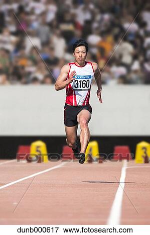 Japanese male sprinter running on track View Large Photo Image Stock Photo - Japanese male sprinter running on track. Fotosearch