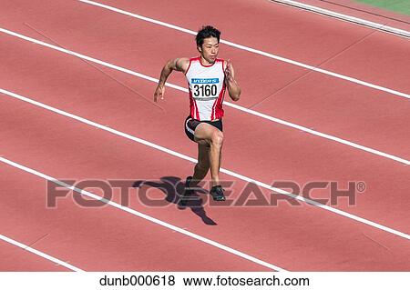 Japanese male sprinter running on track View Large Photo Image Stock Photo - Japanese male sprinter running on track. Fotosearch