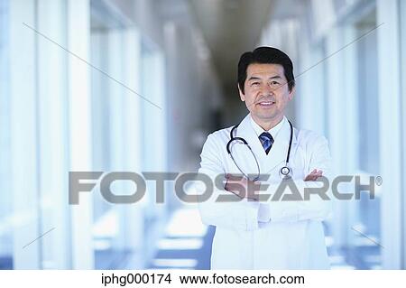 Picture - Japanese senior doctor at the hospital. Fotosearch