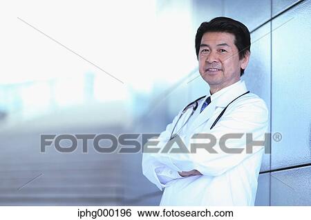 Stock Photograph - Japanese senior doctor at the hospital. Fotosearch