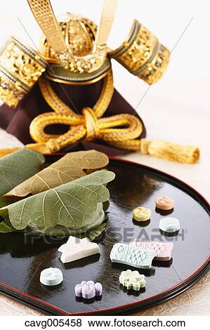 Japanese style Kabuto helm and confectionery View Large Photo Image Stock Photo - Japanese style Kabuto helm and confectionery. Fotosearch