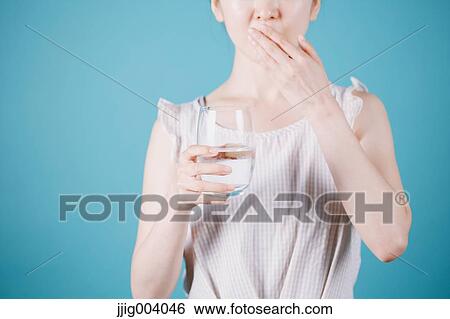 Japanese woman taking pills View Large Photo Image Stock Photograph - Japanese woman taking pills. Fotosearch