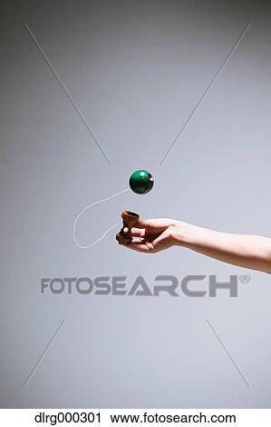 Japanese young man playing with Kendama View Large Photo Image Stock Image - Japanese young man playing with Kendama. Fotosearch