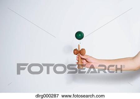 Japanese young man playing with Kendama View Large Photo Image Stock Photo - Japanese young man playing with Kendama. Fotosearch