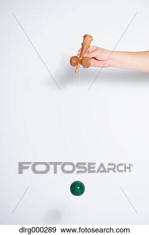 Japanese young man playing with Kendama View Large Photo Image Stock Photo - Japanese young man playing with Kendama. Fotosearch