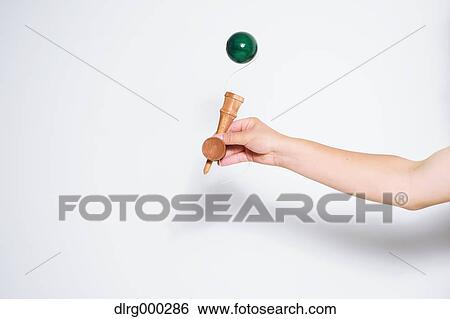Japanese young man playing with Kendama View Large Photo Image Stock Photograph - Japanese young man playing with Kendama. Fotosearch