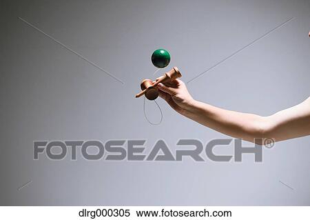 Japanese young man playing with Kendama View Large Photo Image Stock Photography - Japanese young man playing with Kendama. Fotosearch