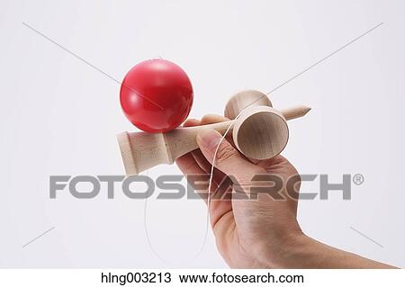 Man playing with Japanese traditional Kendama game View Large Photo Image Stock Image - Man playing with Japanese traditional Kendama game. Fotosearch