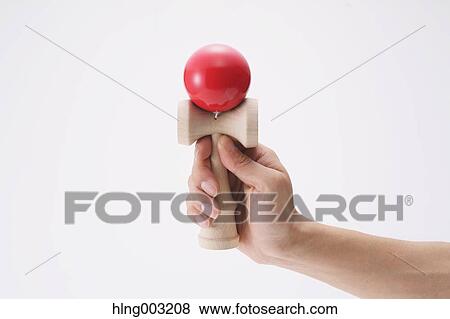 Man playing with Japanese traditional Kendama game View Large Photo Image Stock Photo - Man playing with Japanese traditional Kendama game. Fotosearch