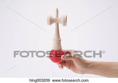 Man playing with Japanese traditional Kendama game View Large Photo Image Stock Photo - Man playing with Japanese traditional Kendama game. Fotosearch