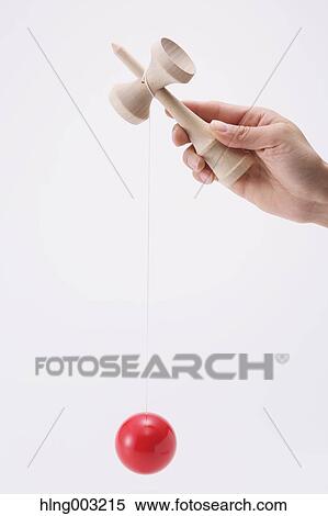 Man playing with Japanese traditional Kendama game View Large Photo Image Stock Photography - Man playing with Japanese traditional Kendama game. Fotosearch