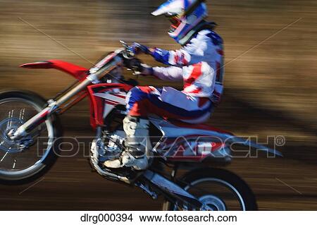 Motocross biker on dirt track View Large Photo Image Picture - Motocross biker on dirt track. Fotosearch