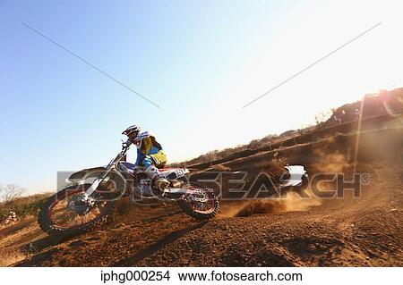 Motocross biker on dirt track View Large Photo Image Picture - Motocross biker on dirt track. Fotosearch