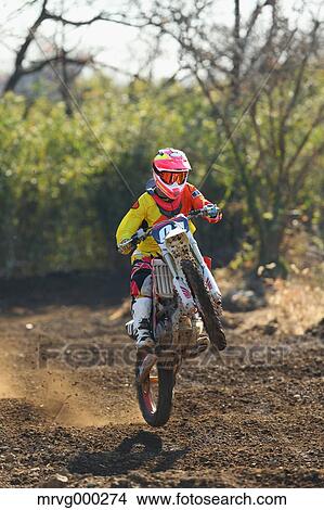 Motocross biker on dirt track View Large Photo Image Picture - Motocross biker on dirt track. Fotosearch