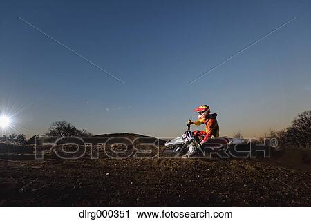 Motocross biker on dirt track View Large Photo Image Stock Image - Motocross biker on dirt track. Fotosearch