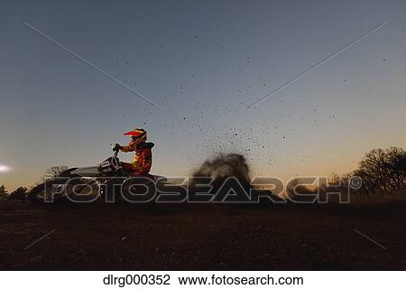 Motocross biker on dirt track View Large Photo Image Stock Image - Motocross biker on dirt track. Fotosearch