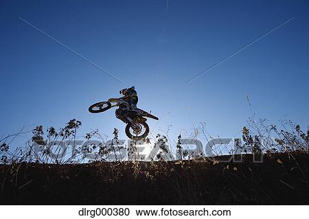 Motocross biker on dirt track View Large Photo Image Stock Image - Motocross biker on dirt track. Fotosearch