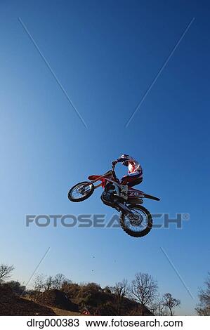 Motocross biker on dirt track View Large Photo Image Stock Image - Motocross biker on dirt track. Fotosearch